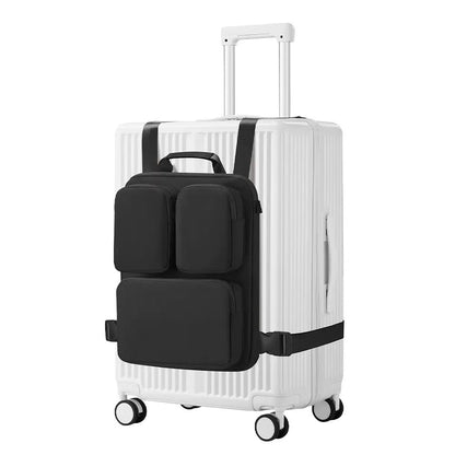 Black luggage handle hanging bag with two front pockets strapped to a white hard shell carry-on suitcase