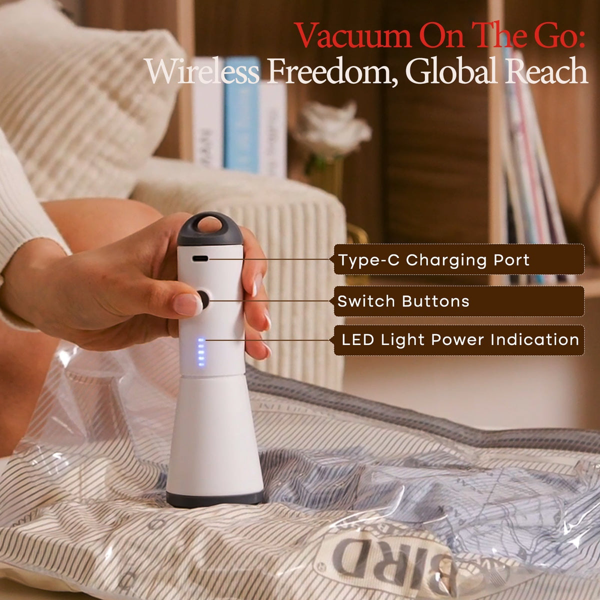 Hand holding the Turbo X7 cordless vacuum pump showing its Type-C charging port, switch buttons and LED power light